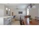 Bright open-plan living space with a kitchen island, dining area, and comfortable seating arrangement at 5275 Warrior Ln, Kissimmee, FL 34746