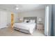Spacious bedroom featuring a king bed, ensuite bath, and neutral color palette at 5275 Warrior Ln, Kissimmee, FL 34746