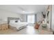 Serene bedroom with a plush king-sized bed, soft lighting, and a cozy seating area at 5275 Warrior Ln, Kissimmee, FL 34746