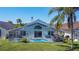 Aerial view of a backyard featuring a screened pool, lanai, and lush green lawn at 529 Eagle Pointe N, Kissimmee, FL 34746
