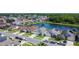 Aerial view of homes, lush landscaping and beautiful pond views at 529 Eagle Pointe N, Kissimmee, FL 34746