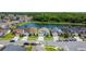 Aerial view of a lovely community with waterfront homes, lush landscaping, and tranquil surroundings at 529 Eagle Pointe N, Kissimmee, FL 34746