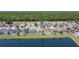 Aerial view of homes and screened-in pools located on a picturesque pond at 529 Eagle Pointe N, Kissimmee, FL 34746