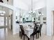 Formal dining room with large mirrors and views of living area at 529 Eagle Pointe N, Kissimmee, FL 34746