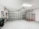Spacious garage with ample storage space and a pet kennel at 529 Eagle Pointe N, Kissimmee, FL 34746