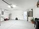 Spacious and organized garage with laundry area, water heater, and room for storage at 529 Eagle Pointe N, Kissimmee, FL 34746