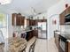 Bright kitchen featuring stainless steel refrigerator and eat-in table at 529 Eagle Pointe N, Kissimmee, FL 34746