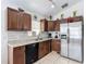 Functional kitchen with stainless steel refrigerator and wood cabinetry at 529 Eagle Pointe N, Kissimmee, FL 34746