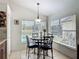 Bright breakfast nook with tile floors, large windows, and backyard views at 529 Eagle Pointe N, Kissimmee, FL 34746