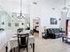 Open living and dining space featuring tile floors and ample natural light at 529 Eagle Pointe N, Kissimmee, FL 34746