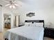 Comfortable main bedroom featuring tile floors and ensuite bath at 529 Eagle Pointe N, Kissimmee, FL 34746