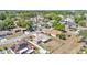 Drone shot of the property in a residential area, highlighting the roof, yard, and community layout at 6056 Hillside Heights Dr, Lakeland, FL 33812