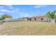 Expansive backyard with a screened patio and fenced perimeter, offering privacy and space at 6056 Hillside Heights Dr, Lakeland, FL 33812