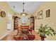 Inviting dining room with a round wooden table, chairs, and decorative lighting at 6056 Hillside Heights Dr, Lakeland, FL 33812
