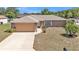 Charming one-story home with a well-maintained lawn and a two-car garage at 6056 Hillside Heights Dr, Lakeland, FL 33812