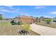 Charming single-story home with attached two-car garage and tidy landscaping at 6056 Hillside Heights Dr, Lakeland, FL 33812