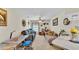 Inviting living room with comfortable seating, a ceiling fan, and natural light from the window at 6056 Hillside Heights Dr, Lakeland, FL 33812