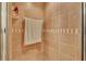 Close-up of tiled shower with a towel bar and built-in shelving at 6056 Hillside Heights Dr, Lakeland, FL 33812