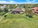 Large lawn and landscaping surround this beautiful house with a screened-in pool and patio at 6132 Waterfield Way, St Cloud, FL 34771