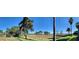 Wide angle shot of the backyard leading to the lake at 6132 Waterfield Way, St Cloud, FL 34771