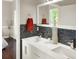Bright bathroom with double sinks, modern vanity, and mosaic tile at 6132 Waterfield Way, St Cloud, FL 34771