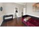 Neutral guest bedroom with a daybed, dark wood floors, and modern decor at 6132 Waterfield Way, St Cloud, FL 34771