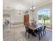 Open dining room featuring natural light, modern lighting, and stylish decor at 6132 Waterfield Way, St Cloud, FL 34771