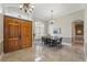 Elegant dining room with double front door, chandelier and tile flooring at 6132 Waterfield Way, St Cloud, FL 34771