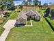 Beautiful home with lush lawn, mature landscaping, and lovely lake views at 6132 Waterfield Way, St Cloud, FL 34771