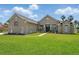 Stunning home with a green lawn and fresh landscaping at 6132 Waterfield Way, St Cloud, FL 34771