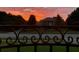 Home exterior viewed through decorative gate at 6132 Waterfield Way, St Cloud, FL 34771