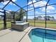 Hot tub beside a screened pool with view to lake at 6132 Waterfield Way, St Cloud, FL 34771