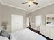 Spacious main bedroom showcasing a cozy bed, dresser, and ample closet space at 6132 Waterfield Way, St Cloud, FL 34771
