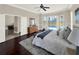 Bright and airy bedroom boasting a pool view, dark floors, and stylish decor at 6132 Waterfield Way, St Cloud, FL 34771