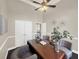 Spacious home office with a wooden desk, comfortable seating, and elegant decor at 6132 Waterfield Way, St Cloud, FL 34771