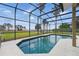 Screened lanai with view of the large backyard at 6132 Waterfield Way, St Cloud, FL 34771