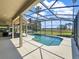 Screened pool with beautiful water view, hot tub and outdoor bar area at 6132 Waterfield Way, St Cloud, FL 34771