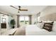 Bedroom with a sliding barn door leading to the bathroom at 614 Heritage Square Dr, Haines City, FL 33844