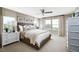 Bright bedroom with ample natural light, neutral decor, and a comfortable king bed at 614 Heritage Square Dr, Haines City, FL 33844