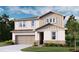 Charming two-story home with a two-car garage, beautiful stone accents and neutral color palette at 614 Heritage Square Dr, Haines City, FL 33844