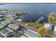Aerial view of the community, showing homes, a lake and the boat docks at 6711 Canterbury Ne Dr, Winter Haven, FL 33881