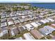 Aerial view showcasing the property's location within a vibrant community near a lake at 6711 Canterbury Ne Dr, Winter Haven, FL 33881