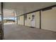 Covered carport and front entrance to home, with an inviting white front door at 6711 Canterbury Ne Dr, Winter Haven, FL 33881