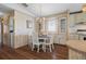 Charming dining area with a table for four, built-in cabinets and lots of natural light at 6711 Canterbury Ne Dr, Winter Haven, FL 33881