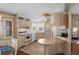 Charming kitchen with classic cabinets, appliances, and an island-style breakfast bar with cozy pendant lighting at 6711 Canterbury Ne Dr, Winter Haven, FL 33881