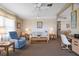 Cozy living room with large windows, comfortable seating and bright, natural light at 6711 Canterbury Ne Dr, Winter Haven, FL 33881
