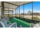 Relaxing screened porch featuring comfortable seating and views of the neighborhood at 6711 Canterbury Ne Dr, Winter Haven, FL 33881