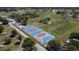 An aerial view of recreational courts surrounded by sports fields and green spaces in a park at 7316 Hunters Greene Cir, Lakeland, FL 33810