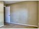 View of a carpeted bedroom with a white door slightly ajar at 7316 Hunters Greene Cir, Lakeland, FL 33810