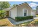 Close up exterior view of home with shutters, trim, and walkway at 7316 Hunters Greene Cir, Lakeland, FL 33810